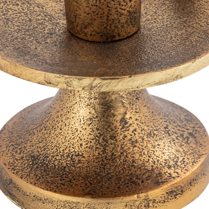 Close-up of a textured bronze candle holder on a white background
