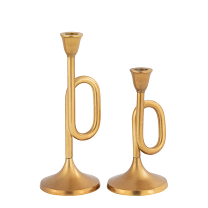 Two gold trumpet-shaped candle holders on a white background