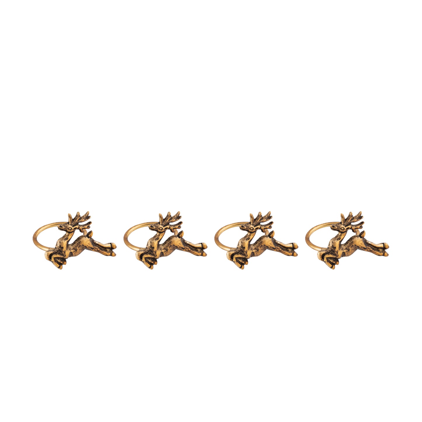 Four gold deer-shaped napkin rings on a white background