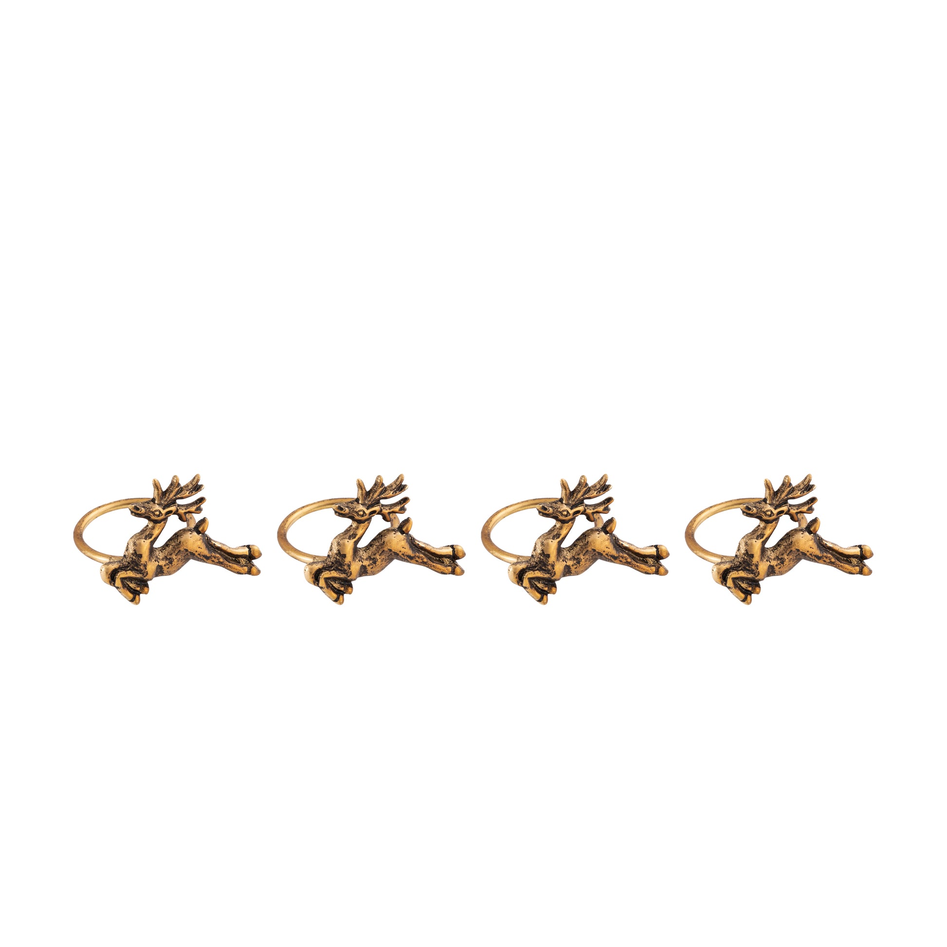 Four gold deer-shaped napkin rings on a white background