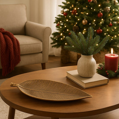 Gold leaf-shaped tray on a wooden surface