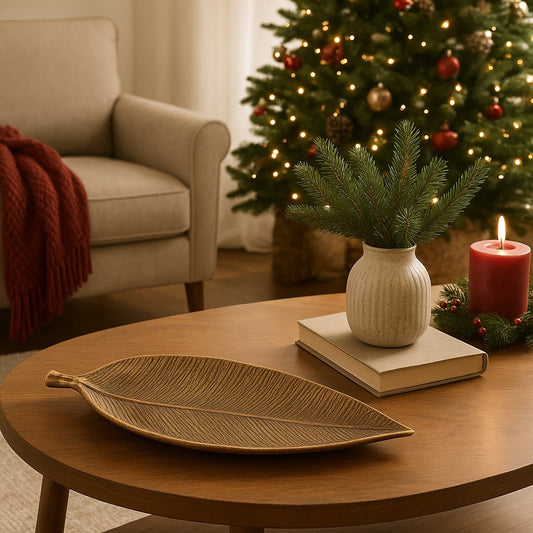 Gold leaf-shaped tray on a wooden surface